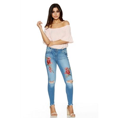 Light blue and red denim rip knee jeans